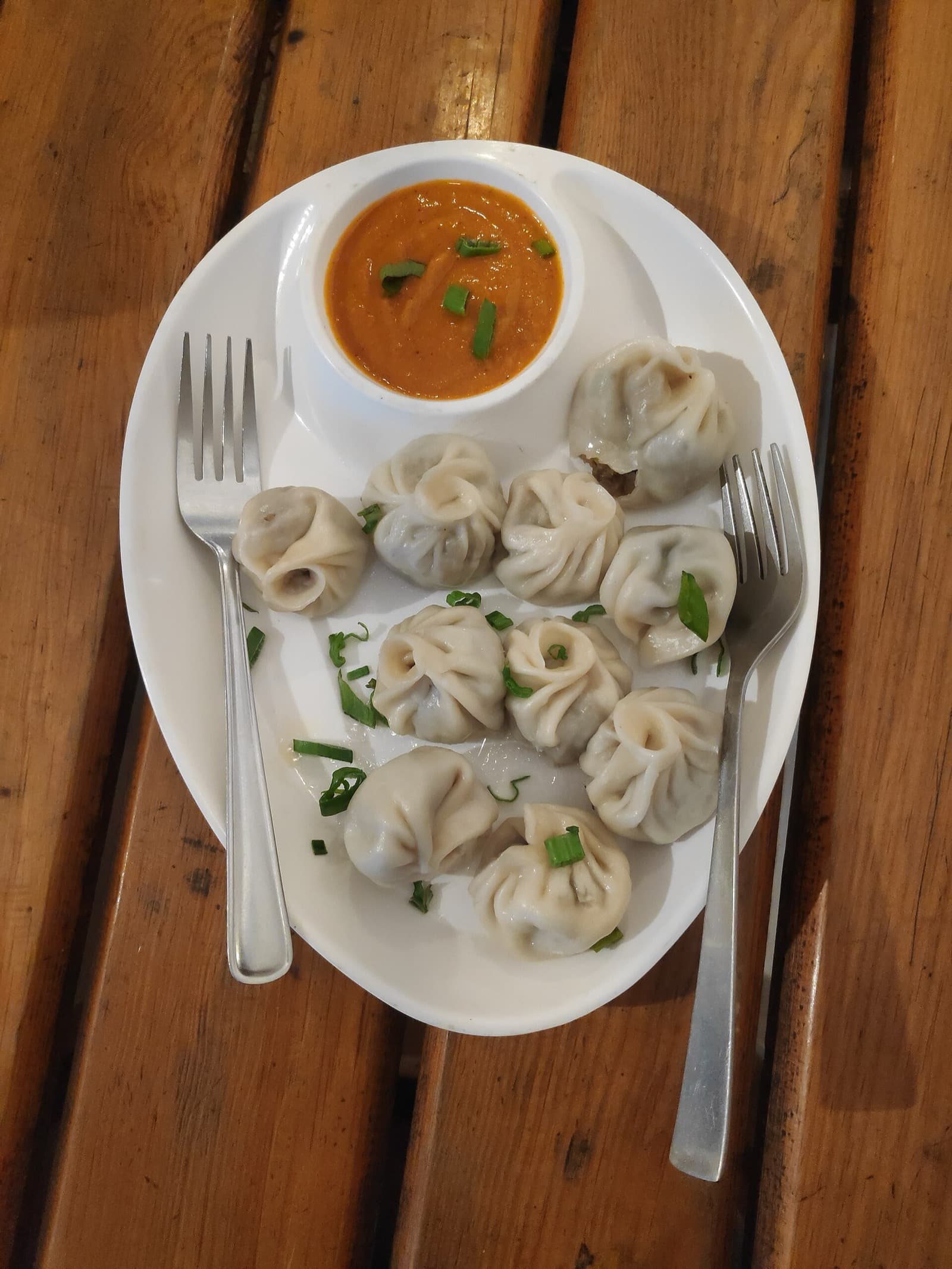 A plate of buff momo with achar